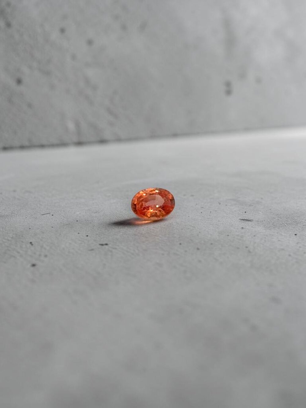 0.54 Carat Oval Orange Sapphire Gemstone